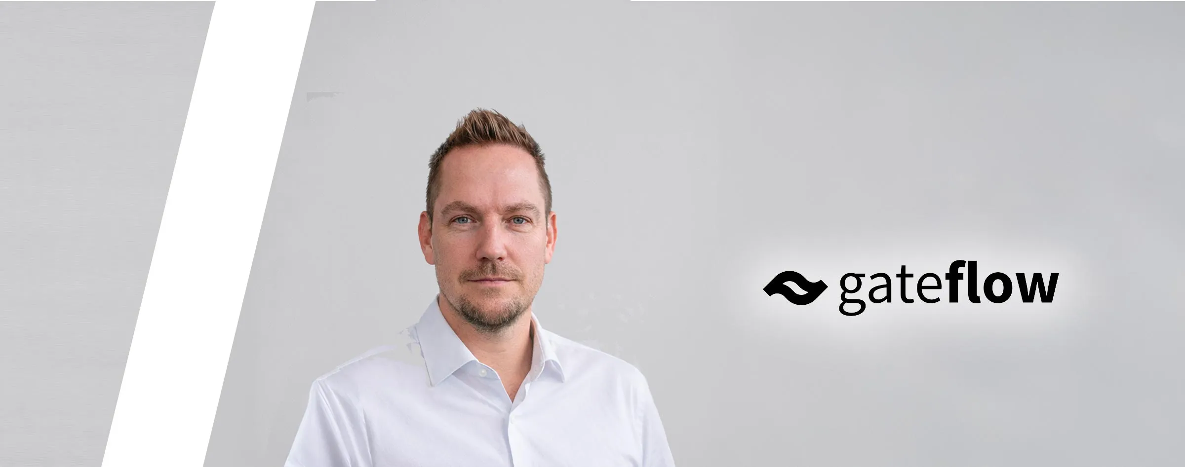 Michael Wutzke, managing director of Gateflow GmbH, Frankfurt, next to the Gateflow wordmark